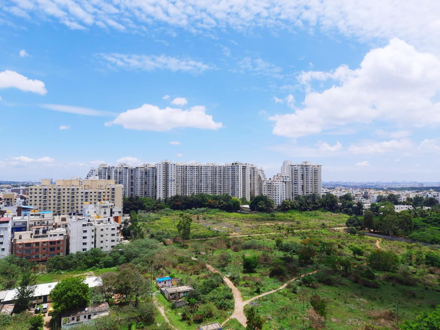 Aerial view of a planned land development project by AXXION Prime Realty LLP